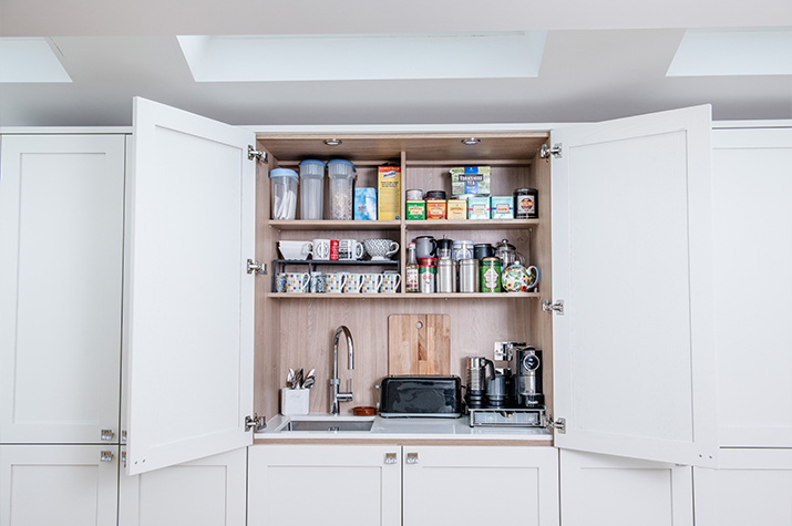 Open hidden kitchen sink unit