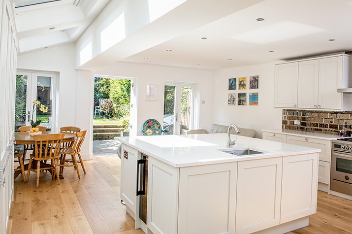 white kitchen and living space