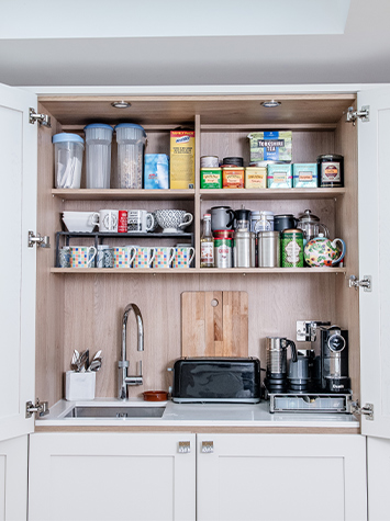 close-up of open hidden kitchen sink unit