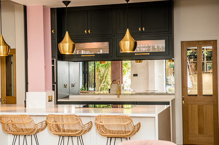 kitchen island with chairs and light fixture