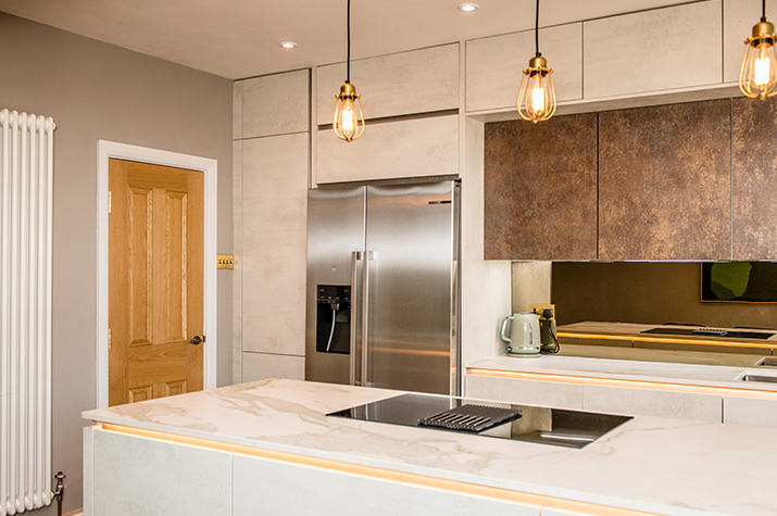 kitchen island with fridge and light fixture