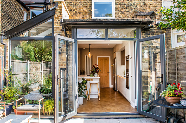 Outside garden looking in with view of kitchen